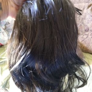 Ponytail hair piece with drawstring.